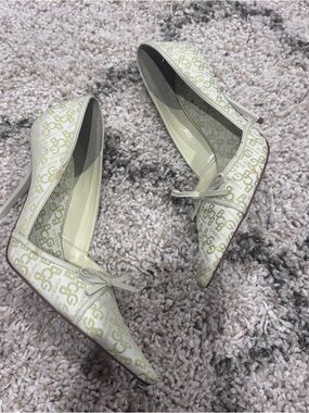 BCBGirls Ivory Pointed-Toe Heels with Light Green Monogram & Bow